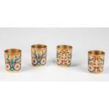 A set of four silver-gilt and cloisonné enamel vodka beakers. Russia, Moscow, IvanSaltikov, 1895.