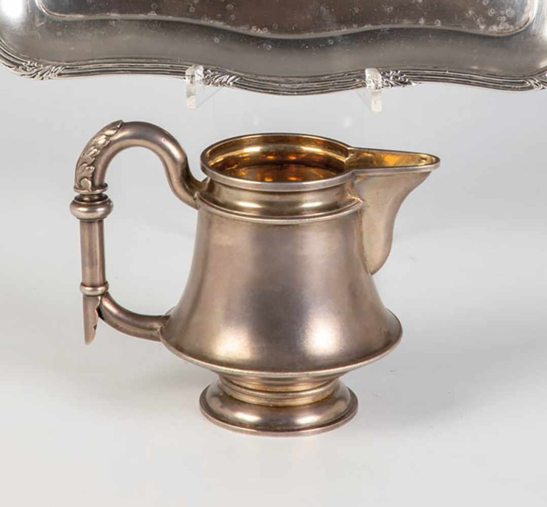 A silver jug. Russia, St. Petersburg, Aleksandr Pokin (1882-1898), 1896. Gilt interior.Handle with