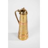 A brass and copper jug. Russia, circa 1930. Hammered decor. Two copper overlays. Bottomwith