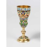 A silver-gilt and cloisonné-enamel beaker. Stamped Moscow, Griogrii Sbitnev, 1908-1917.Tapering