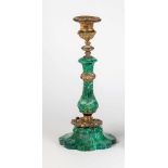 A malachite and brass candlestick from royal property. 19th century. Eight-faceted foot.Baluster