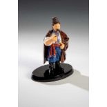 A realistically carved hardstone figure of a peasant. In the manner of Fabergé, 2nd halfof the