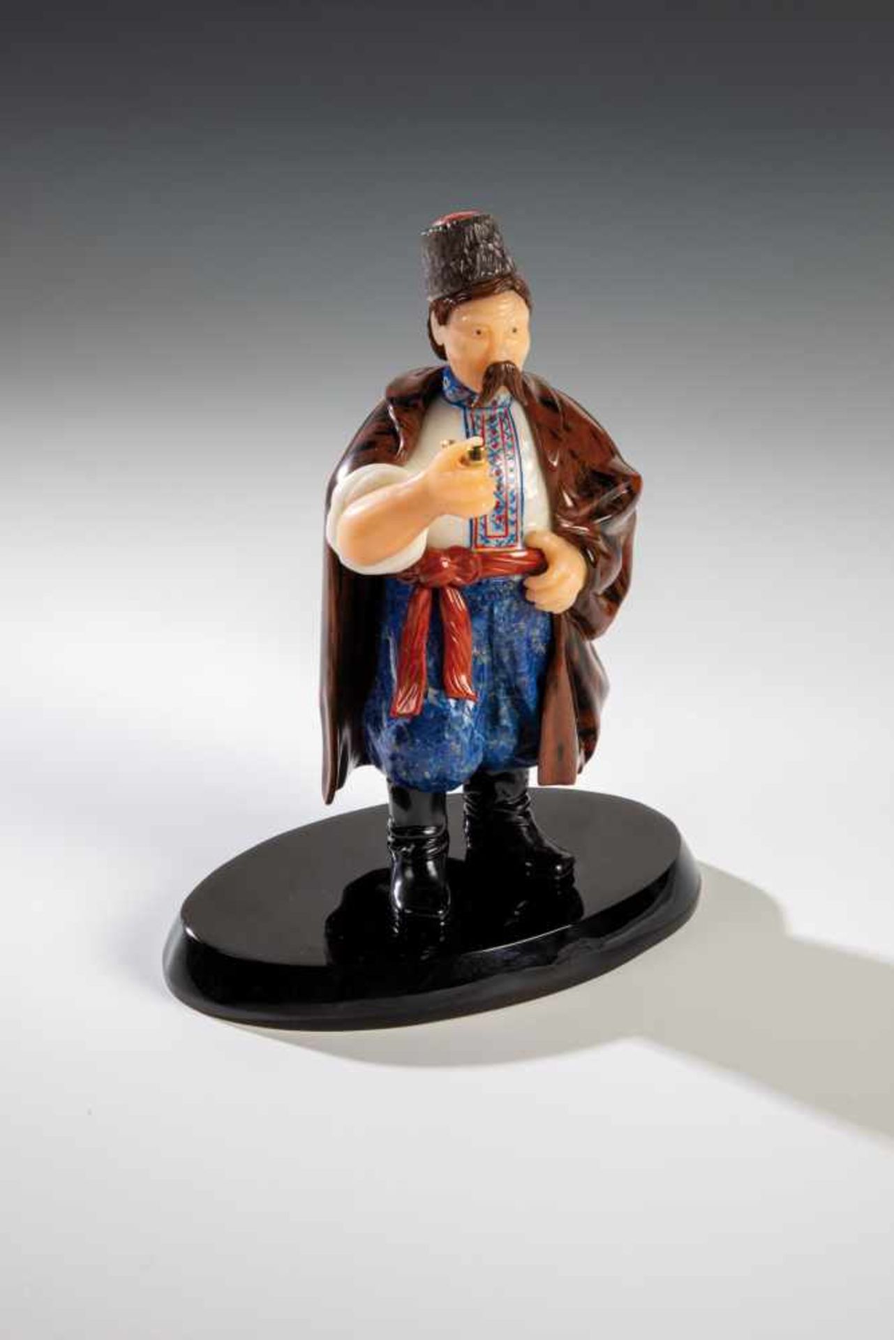 A realistically carved hardstone figure of a peasant. In the manner of Fabergé, 2nd halfof the