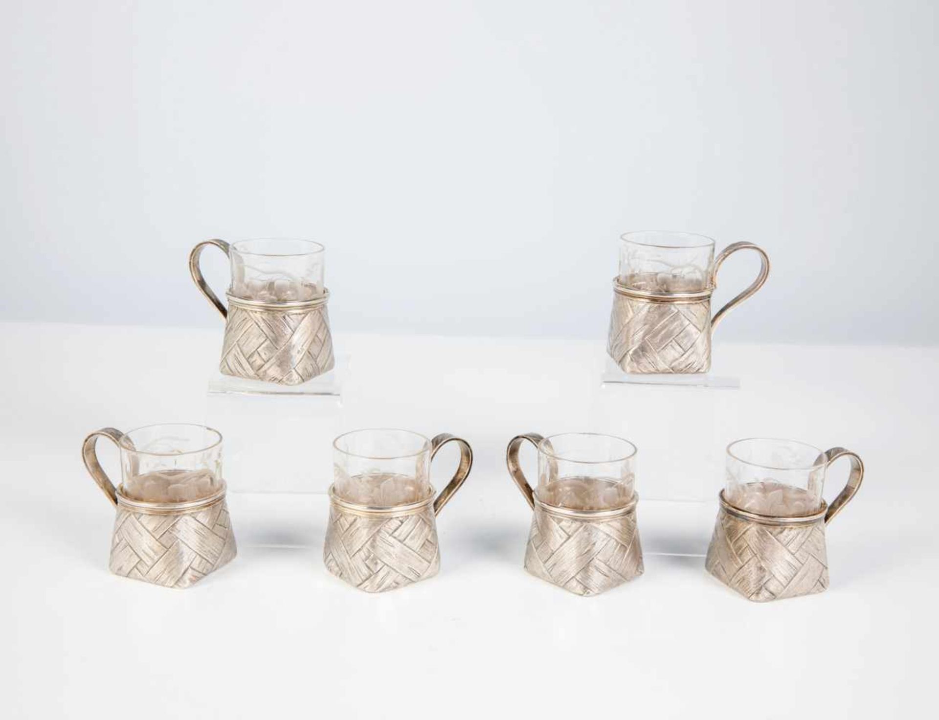 Six silver trompe l'oeil tea holders. Stamped St. Petersburg, Victor Ivanov, 1892-1898.Body and