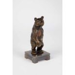 A realistically cast bronze bear. On agate stone stand (small chip). 14.5 cm high.BärBronze,