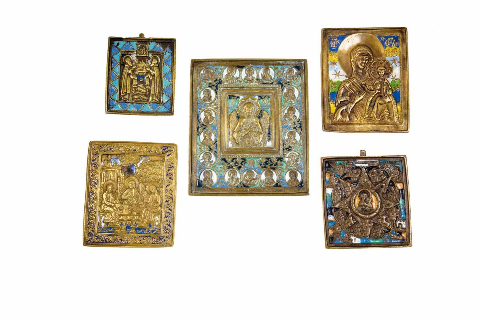 Five brass icons. Russia, 18th/19th century. Cast in relief, all with polychrome enamel.Enamel