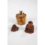 Three Netsuke. Japan, Meiji period, 19th century. Wood and ivory. 6 cm, 4.5 cm and 3 cmhigh.