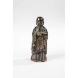 Monk. China, probably Ming Dynasty (1368 - 1644). Standing buddhist monk with salute oradoration