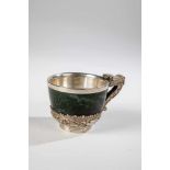 Cup with handle in the form of a dragon and surrounding relief decoration. Tibet,19th/20th