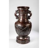 A large baluster vase. Japan, Meiji period, 19th century. Bronze brown patinated. Withrelief bird