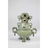 Cover container. China, 19th century. Decorative object in the shape of an incense burner.Gray-green