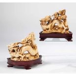 Two dragons. China, 19th century. Ivory on a wood base. 11.5 cm high (without base).Please note that