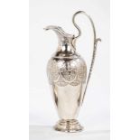 A silver jug. Austria, Vienna, I. Hosp, 1814. Foot, body and hinged lid with flowers andleaves on