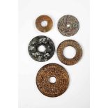 Five coins/amulets. China, Qing Dynasty. Discs with figurative and abstract reliefdecoration.