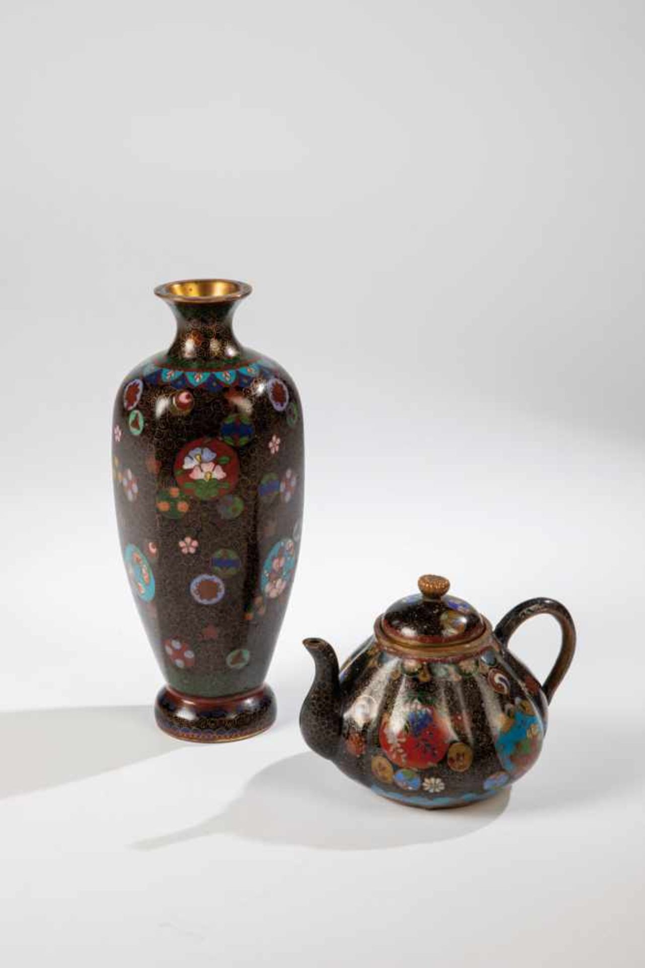 Vase and miniatue teapot. Japan, Meiji period, 19th century. Metal with polychrome