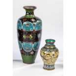 Two cloisonné vases. China, 19th century. Circumferential, polychrome decorationconsisting of flower