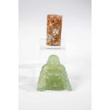 Laughing budai and amulet with dragon. Carved jade. China, 20th century. H. 6 cm.Konvolut JadeChina,