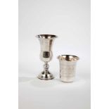 Two silver judaica cups. 20th century. Engraved star of david. Stamped with ''STERLING''. 7- 12.5 cm
