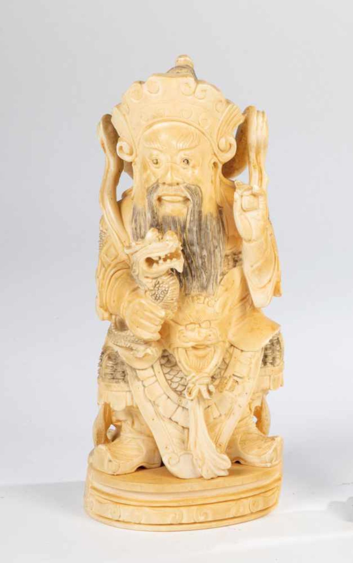 dignitary. China, 19th century. Sitting dignitary with beard and dragon. Inscribed on