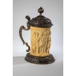 A large silver and ivory tankard with a bacchanalia scene. Germany, 19th century. Ovalfoot with