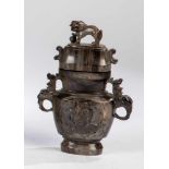 lidded vase. China, 20th century. Baluster-shaped vase with handle in the form of dragonand