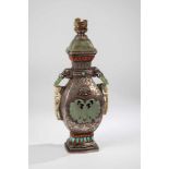 Lidded vase. Mongolia, 19th century. Baluster-shaped vase, neck with two sculptured animalheads,