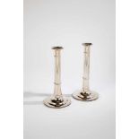 A pair silver candlesticks. Austria, Vienna, I. Binder, 1818. Round foot with engravedleaf border.