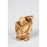 Netsuke. Japan, Meiji period, 19th century. Hotei. Ivory. 5 cm high.Please note that this lot cannot