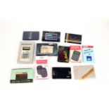 12 Electronic Calculators in Original Card Cases,