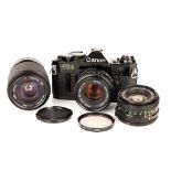 A Canon AE-1 Program SLR Camera,