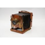 An Unmarked Half Plate Mahogany Field Camera,