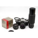 A Canon AE-1 Program SLR Camera,