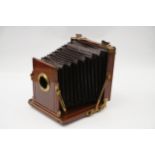 A Mc Kellen's Double Pinion Treble Patent Whole Plate Mahogany Field Camera,