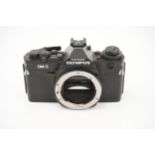 An Olympus OM-3 SLR Body,