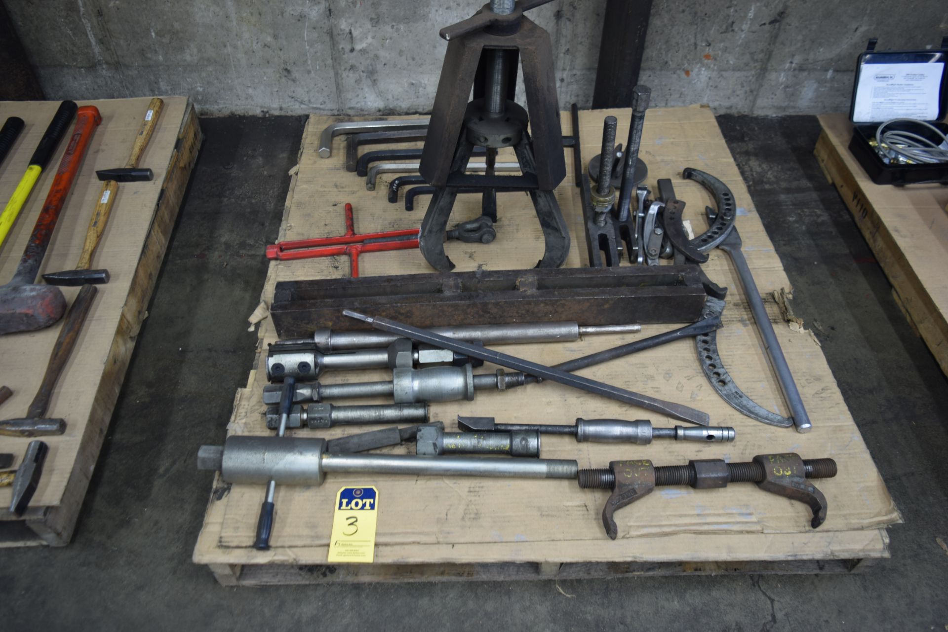 skid of pullers and Allen wrenches