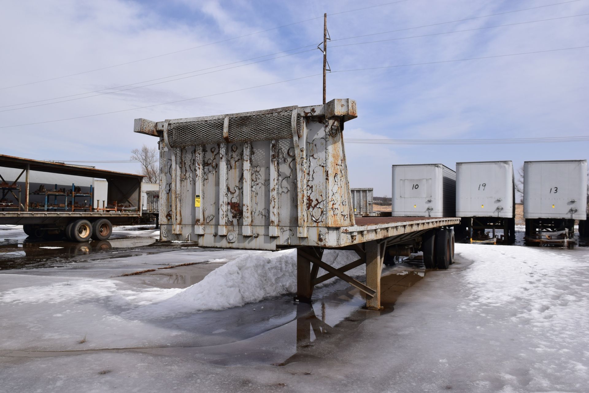 40' dual axle flat bed trailer not road worthy, no contents