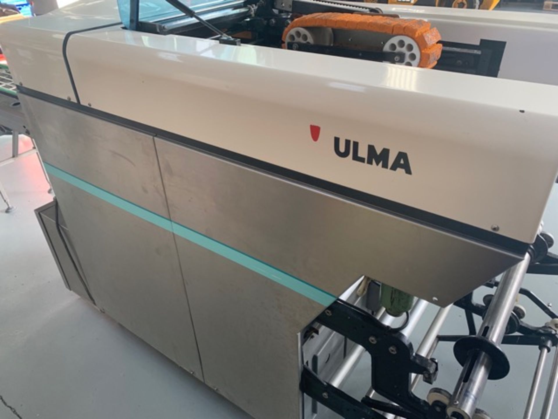 2 x Ulma Super Chics. Ulma Super-chic stretch wrap machine. Capable of up to 60 packs per minute. 1