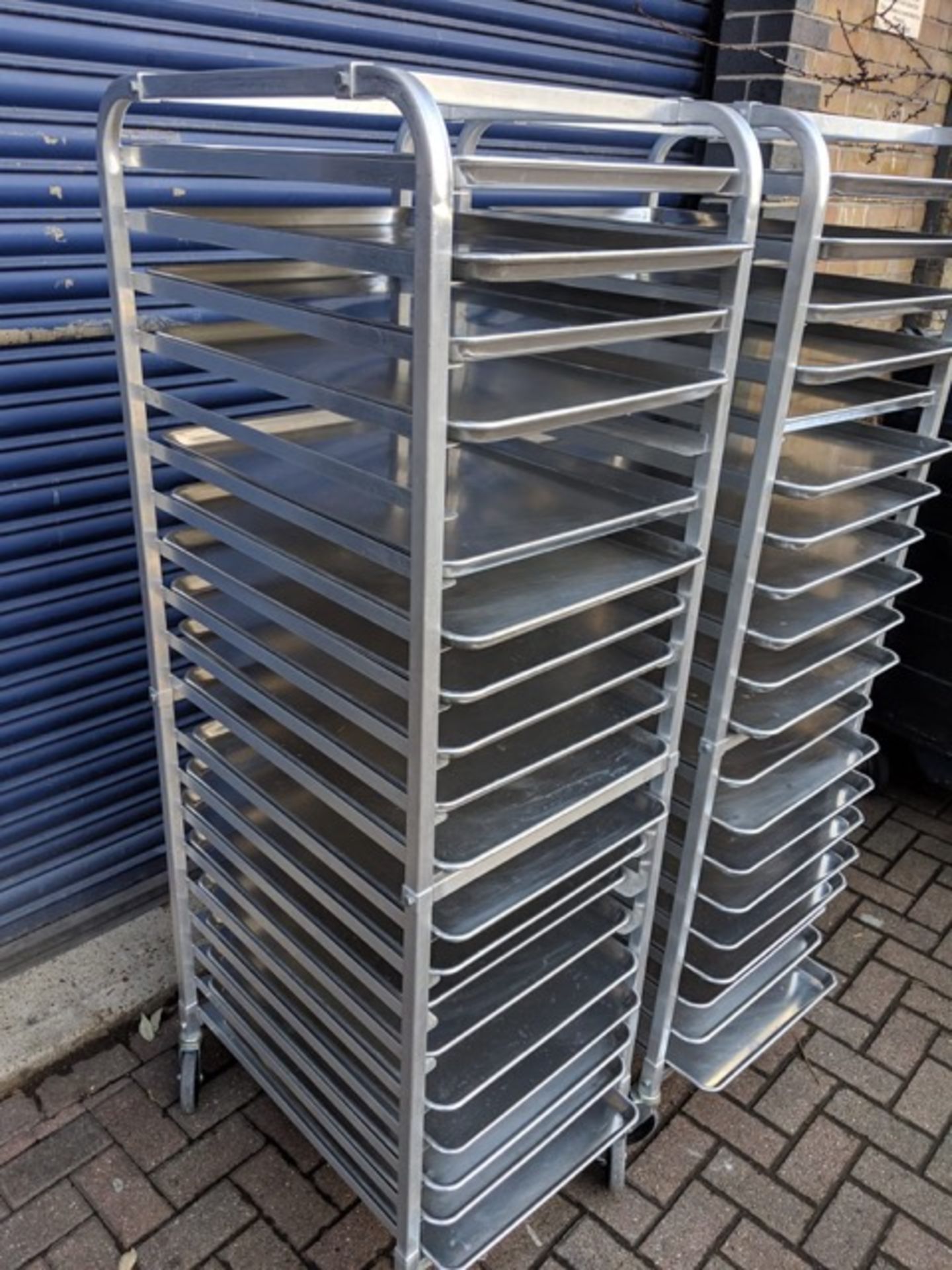 2 x Racks, with approx. 20 trays per rack. Approx. Trolley is 52cm wide x 66cm deep x 175cm high