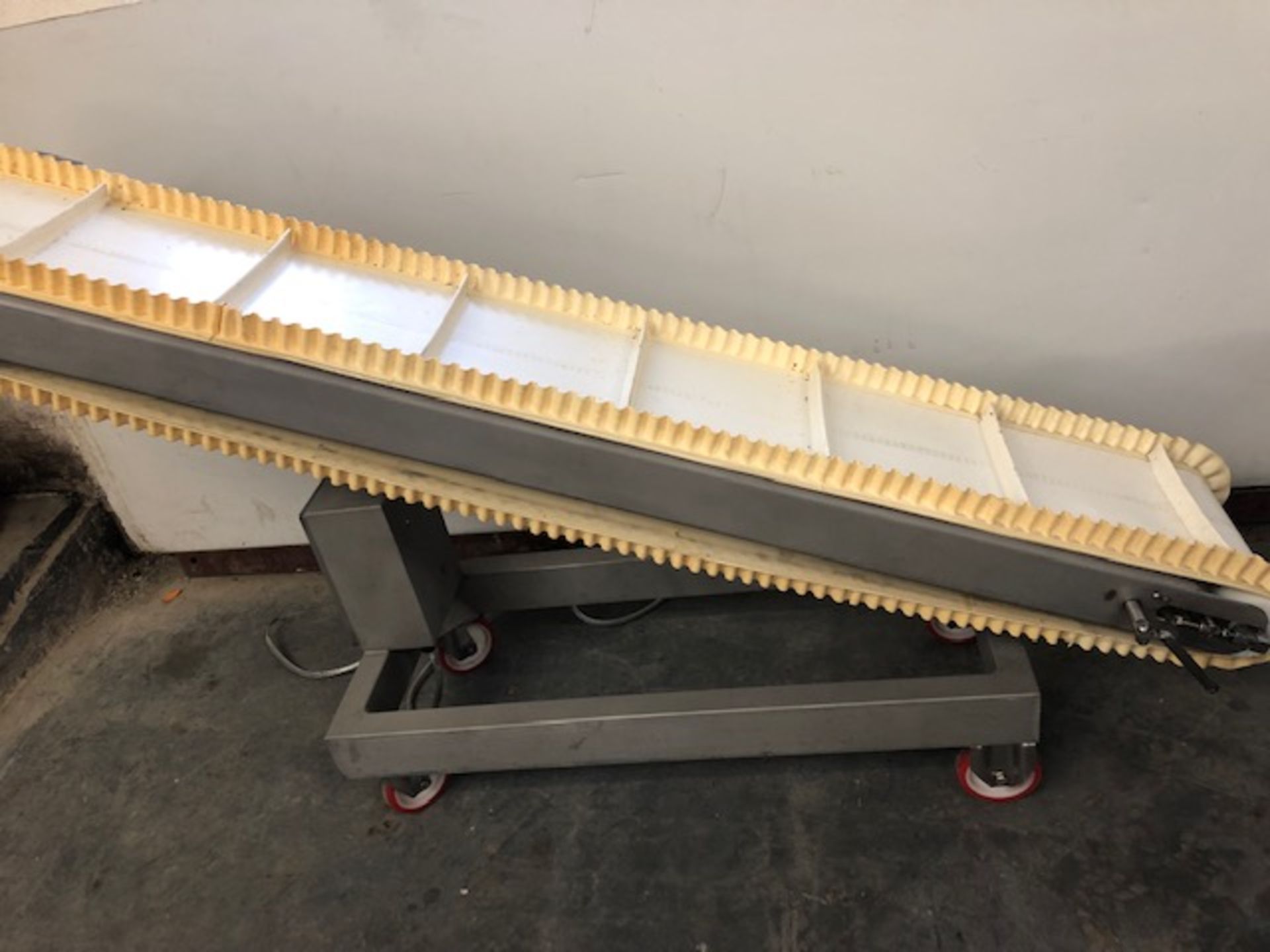 Incline belt Conveyor. Belt width 300mm. In at 400mm. Out at 1 metre. Overall 2.1 metr. Lift out £30