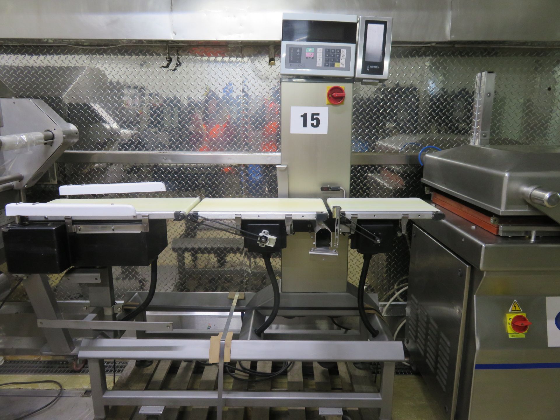 Ishida Dacs Check Weigher, weigh platform 440mm long x 250mm wide. Push arm. Mobile on Lift out £60