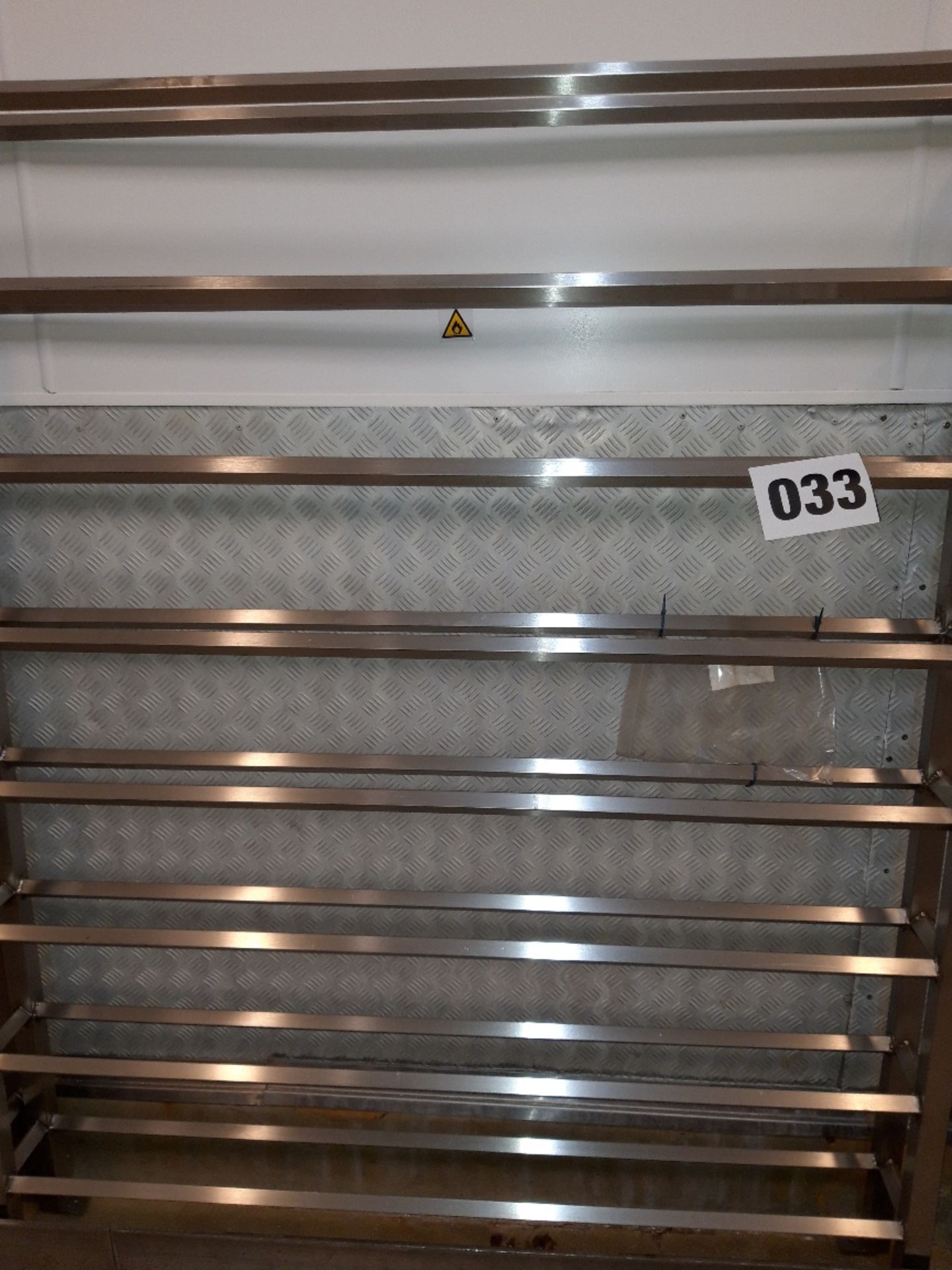 S/s Shoe Rack. Floor standing, approx 1.5 metres long x 1.8 metres high x 200mm wide Lift out £10