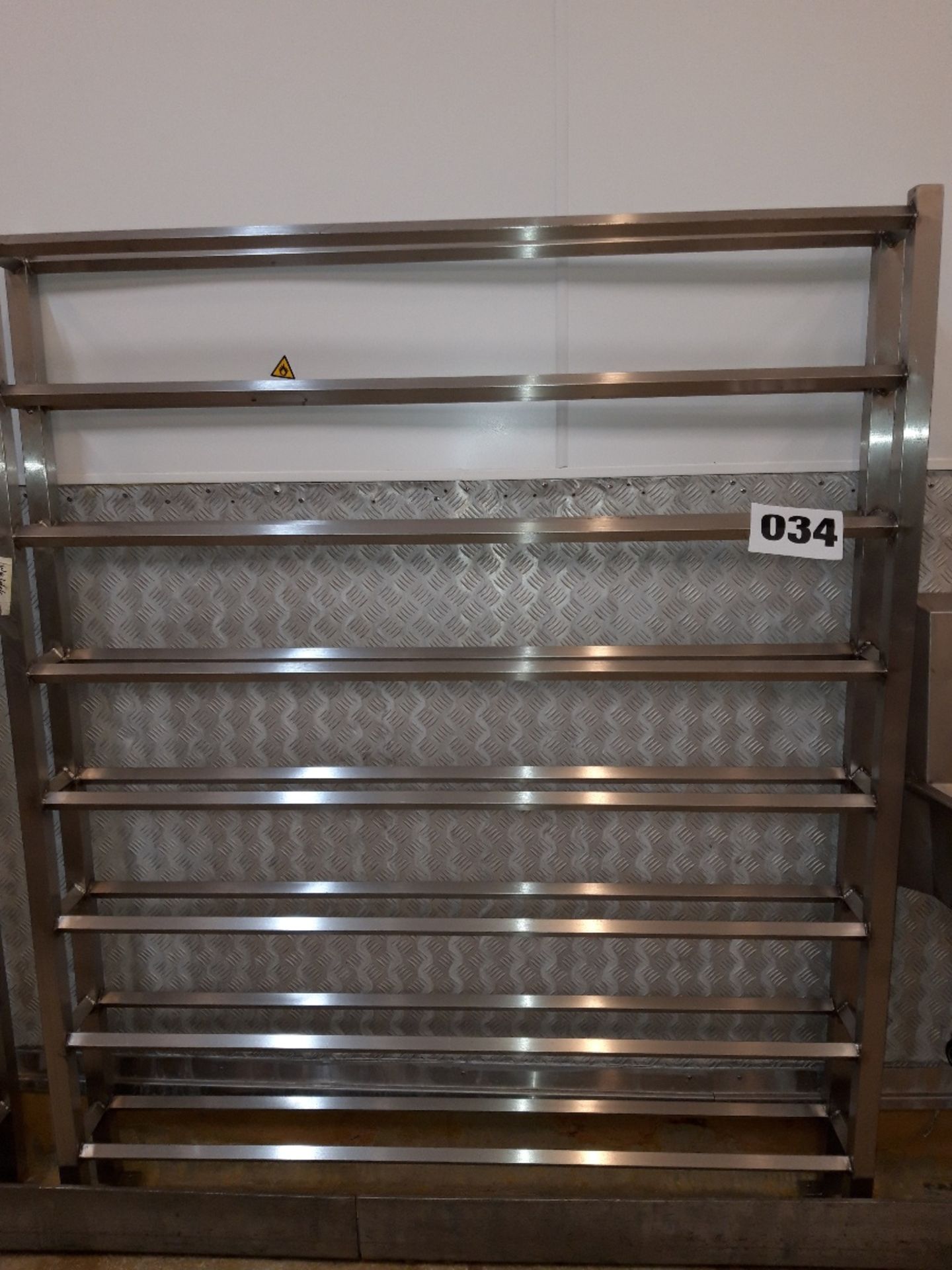 S/s Shoe Rack. Floor standing approx 3.1 meters long. Lift out £10