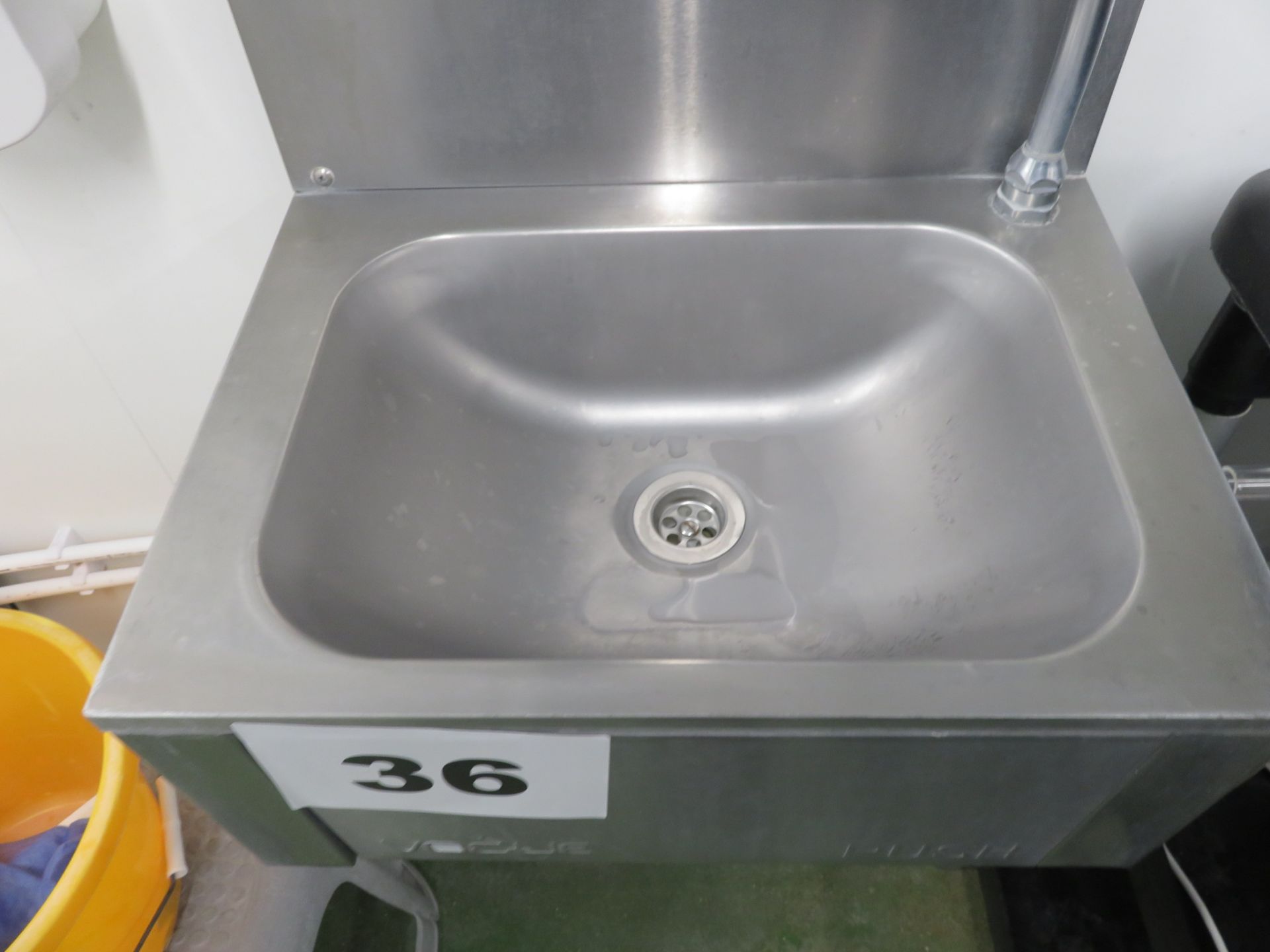 S/s wall mounted sink. LO £15.