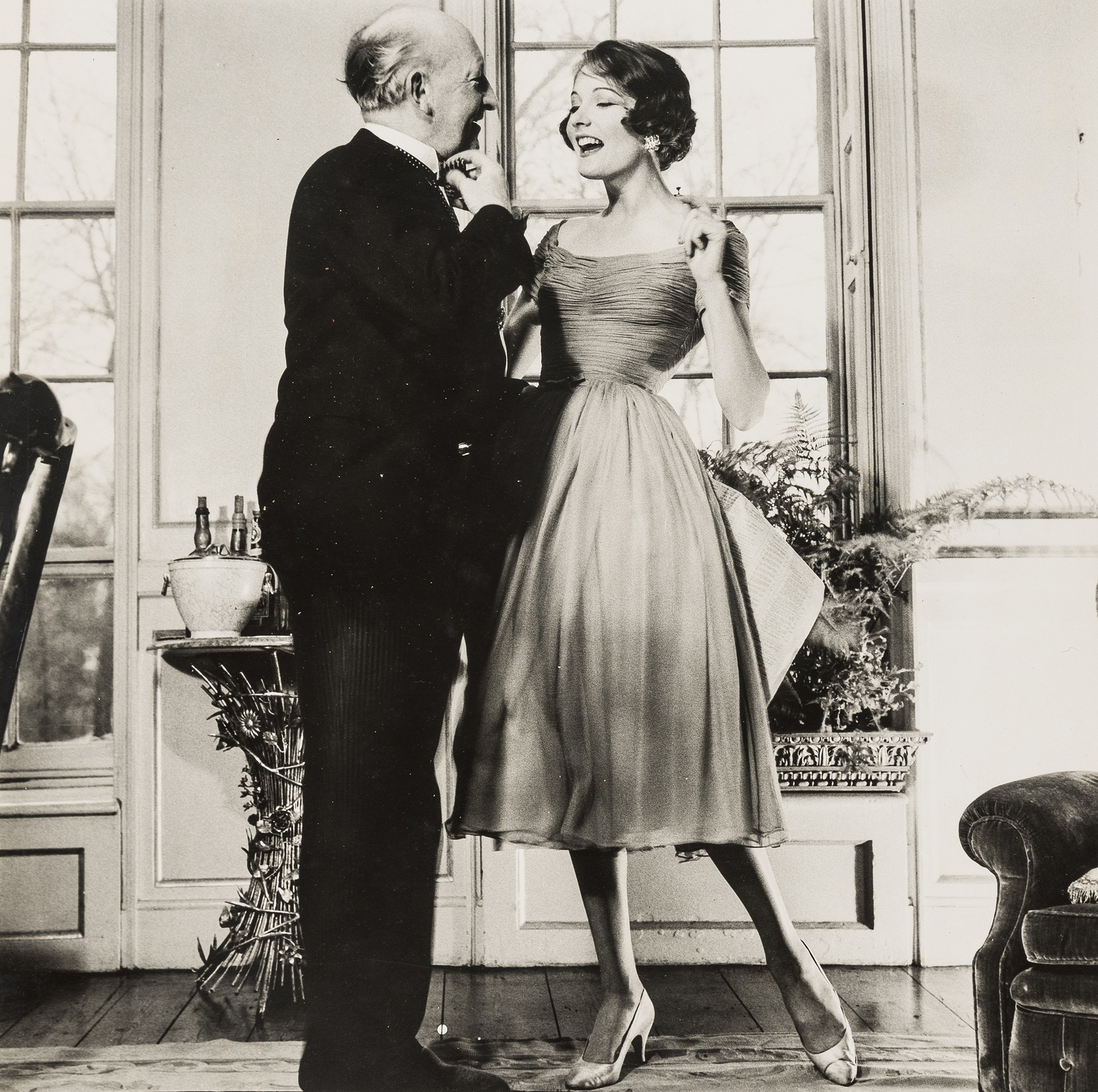 NO RESERVE Norman Parkinson (1913-1990) Woman at Window Looking at Man; Carrying Across Puddle - Image 3 of 3