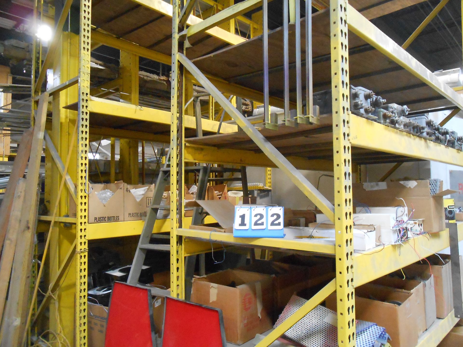 2 Yellow Pallet Racks and Contents