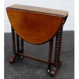 Small mahogany drop leaf table, on bobbin supports and ceramic castors, 60 x 55cm