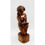 Female hardwood carved figure on lotus base, 48cm high