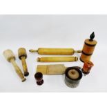 Quantity of wooden kitchenalia to include an egg cup, pepper grinder, butter pats, rolling pins