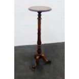 Mahogany torchere, the circular top on baluster column and tripod legs