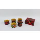 Group of late 19th century Mauchline 'Tartan Ware' to include four napkin rings, small circular box,